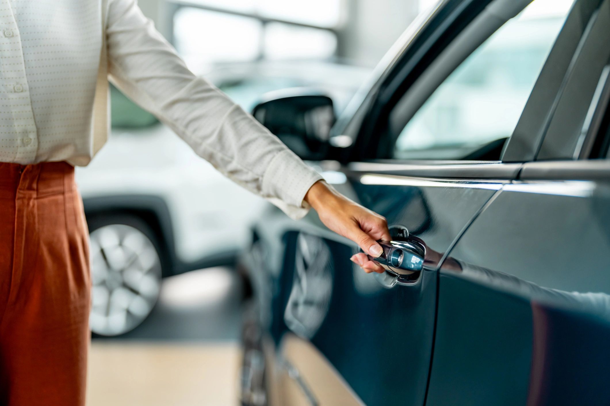 Close-up of a car door being opened