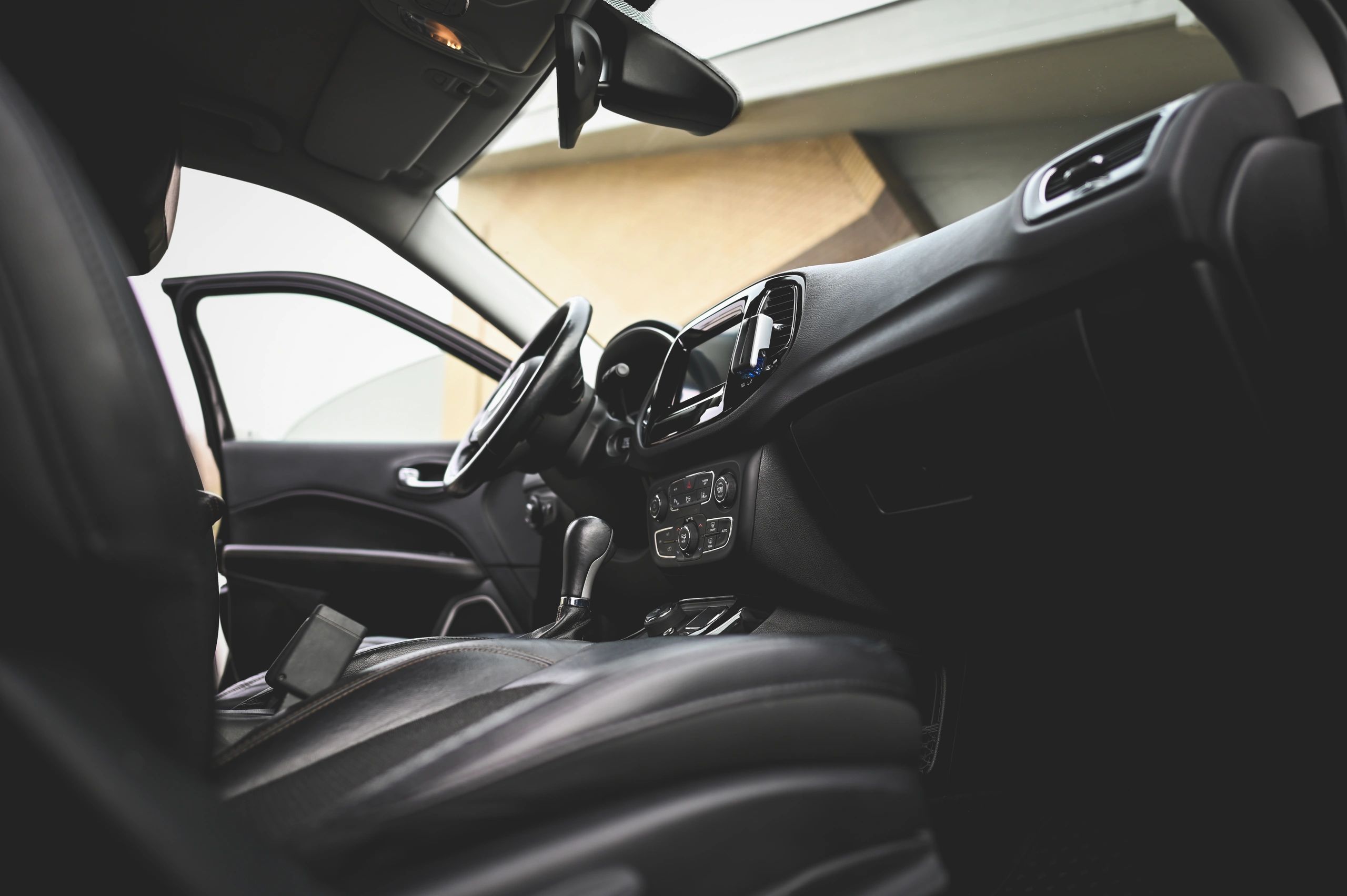 Modern car interior showing dashboard and leather seats